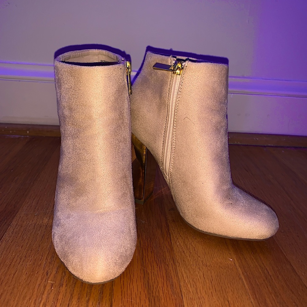 Cream heeled boots with a gold back, size 5.5